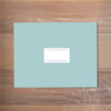 Chic Initial mailing label shown in Night on Pool presentation envelope